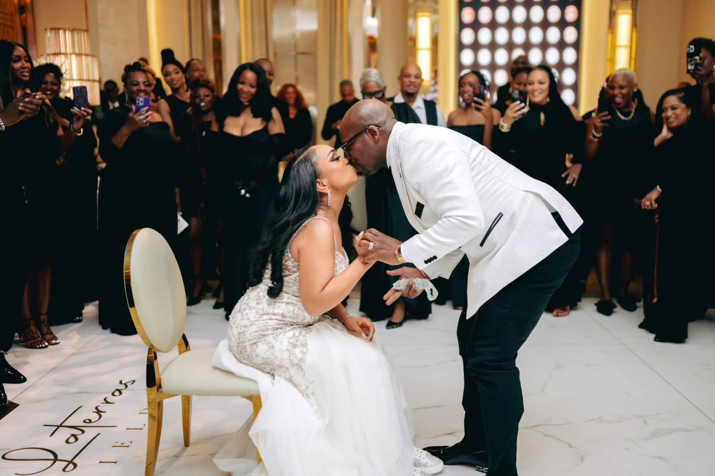 Laterras and Ashley kissing at their wedding