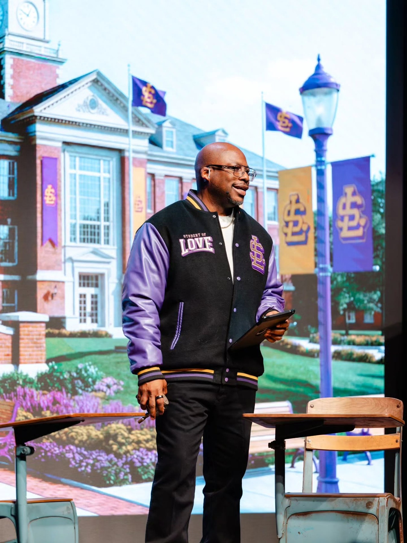Laterras presenting in his Student of Love varsity jacket